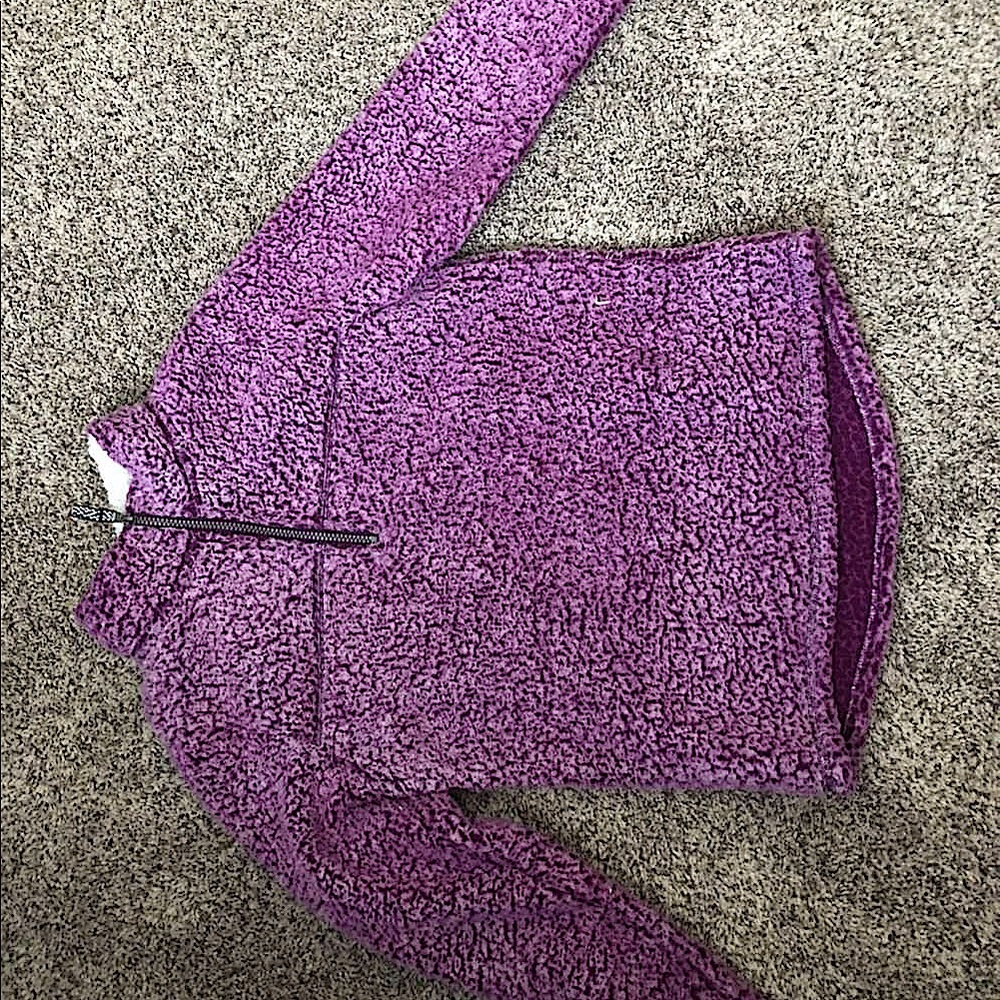 A purple, quarter zip, Sherpa sweatshirt.